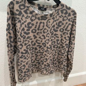 A cheetah print sweater